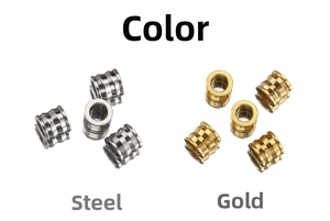 Macro detail of cylindrical steel and gold spacer beads with grooved texture for DIY jewelry