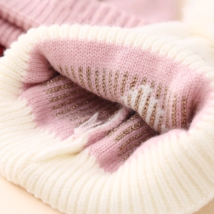 Pink and white knit baby hat with gold metallic thread and thick layered texture