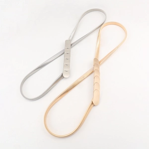 Adjustable elastic gold and silver metal spring belts with sleek buckle in a pair