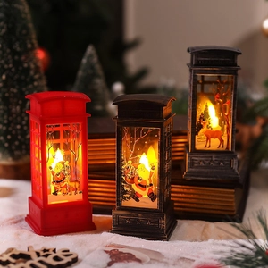 Close-up of vintage Christmas telephone booth lanterns with Santa and reindeer scenes