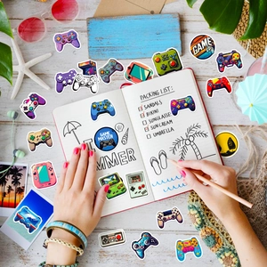 50pcs waterproof game stickers featuring controllers and master patterns on beach backdrop