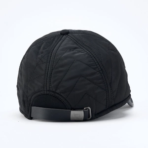 Rear view of quilted winter baseball cap with adjustable leather strap and metal buckle