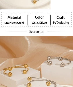 Macro detail of minimalist stainless steel ball bangle with PVD gold and silver plating