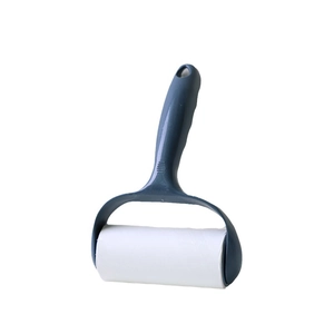 Portable blue lint roller with sticky paper roll for removing hair from clothing