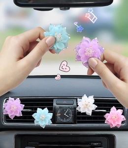 Detailed close-up of crystal lotus car air freshener clips in multiple colors