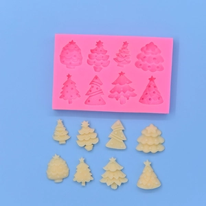 Pink silicone mold with 8 Christmas tree shapes for DIY baking and crafts