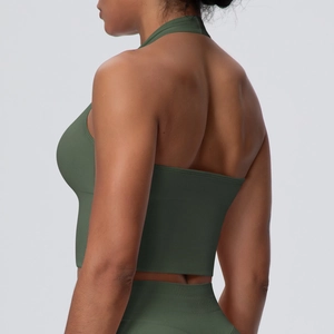 Detailed back view of dark green high-waisted ribbed leggings and halter neck sports bra set
