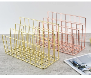 Detail of Nordic gold and rose gold wire desk organizers for magazines and documents