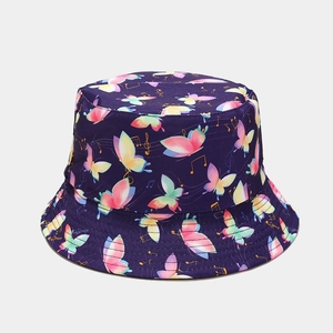Detail of purple bucket hat with colorful butterfly and musical note print patterns