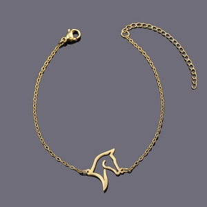 Detailed close-up of a gold-plated horse head pendant on a polished link chain with clasp