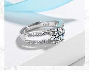 Close-up of S925 sterling silver ring featuring a round zircon and pave-set split band
