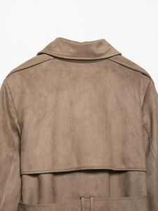 Detail of the back collar and shoulder on a brown faux suede trench coat