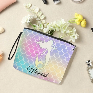 Mermaid scale print makeup organizer bag with zipper and mermaid silhouette text