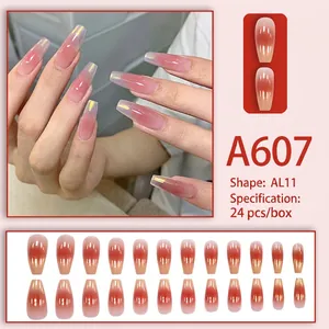 Detail of A607 peach gradient coffin press-on nails with elegant gold rim accents