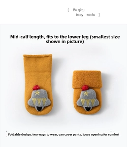 Detailed view of yellow baby socks with plush monster head and cute star embroidery