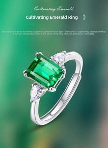 Detail of adjustable silver ring with princess cut emerald and pear side stones