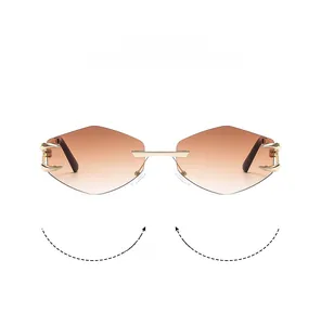 Detail view of rimless diamond-shaped sunglasses with gradient brown lenses