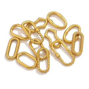Detailed macro view of gold-plated stainless steel oval earring connectors for DIY jewelry