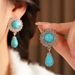 Vintage silver finish earrings set with turquoise stones and shimmering micro diamonds