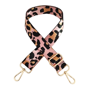 Detail of adjustable pink leopard print wide strap with golden metal swivel hooks