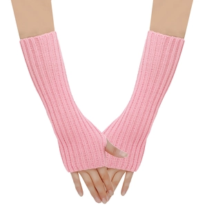 Pink knit fingerless arm warmers with thumb holes and ribbed texture for winter