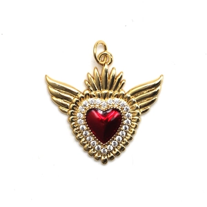 Detailed view of heart-shaped gold pendant with red gem, wings and cubic zirconia inlay