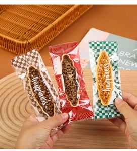 Close-up of clear plastic bags sealing almond caramel boat snacks with Get Lucky text