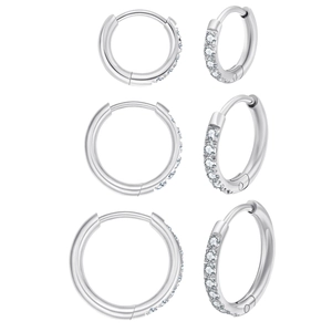 Macro view of three sizes of silver pavé hoop earrings with round cubic zirconia stones