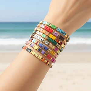Bohemian Tila bead bracelet set for women with colorful tile beads on beach background