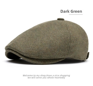 Detailed close-up of dark green wool blend tweed fabric texture on a flat cap hat