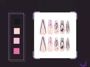 Detailed view of Halloween press-on nails featuring pink bases with black spider web art