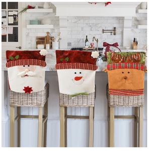 Close-up of Santa, Snowman, and Reindeer chair covers with festive embroidery