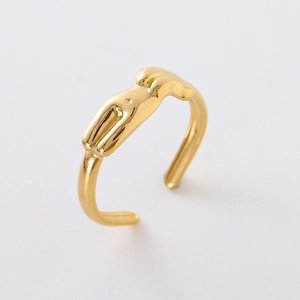 Artistic gold-plated human body shape open ring with polished finish on gray background