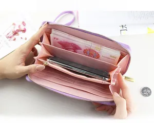 Macro view showing the multi-slot interior of the purple large capacity long wallet