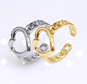 Detail of gold and silver open heart rings with hollow design in high quality finish