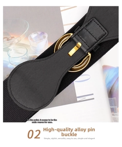 Detail of wide black elastic waist belt with premium golden alloy buckle and fine leather edging