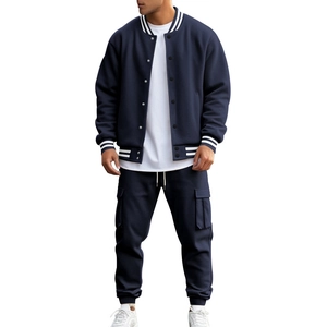 Detail of cargo pants large pocket and ribbed cuffs on navy blue athletic tracksuit