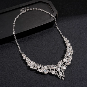 Macro detail of luxury silver necklace with pear-cut crystals and adjustable chain link