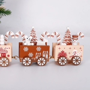 Detail of wooden Christmas train with miniature snowmen, trees and festive painted patterns