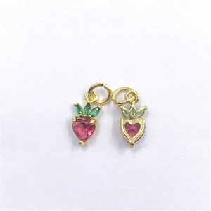 Gold strawberry pendant with pink heart-shaped crystal and green leaf zircons for DIY jewelry