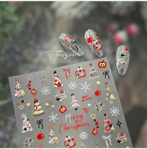Détails d'autocollants pour ongles de Noël avec pomme rouge, sapin et nœuds