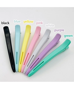 Collection of matte seamless large hair clips shown in various vibrant colors