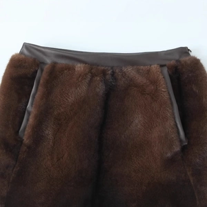Deep brown faux fur skirt with premium leather stitching and plush texture
