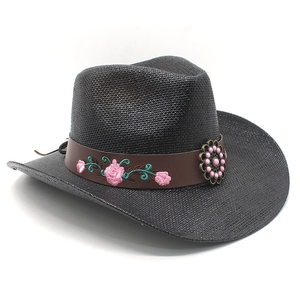 Detail of black straw cowboy hat featuring brown leather band with pink rose embroidery
