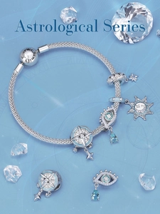 Close-up of S925 silver Astrological bracelet with Evil Eye and Sun charms