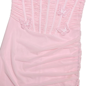 Detailed view of pink mesh dress featuring elegant ruched pleats and 3D butterfly embroidery