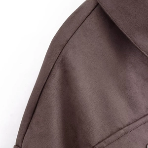 Detailed close-up of dark brown faux suede jacket collar with premium stitching details