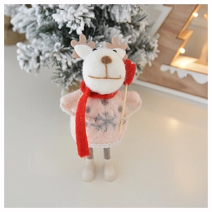 Close-up of wool felt reindeer doll with pink sweater and heart accessory for Christmas