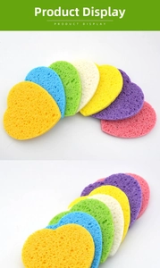 Macro detail of heart-shaped compressed wood pulp sponges in multiple vibrant colors