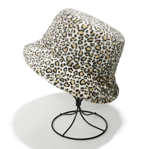 Close-up of leopard print faux fur bucket hat texture and plush winter material details